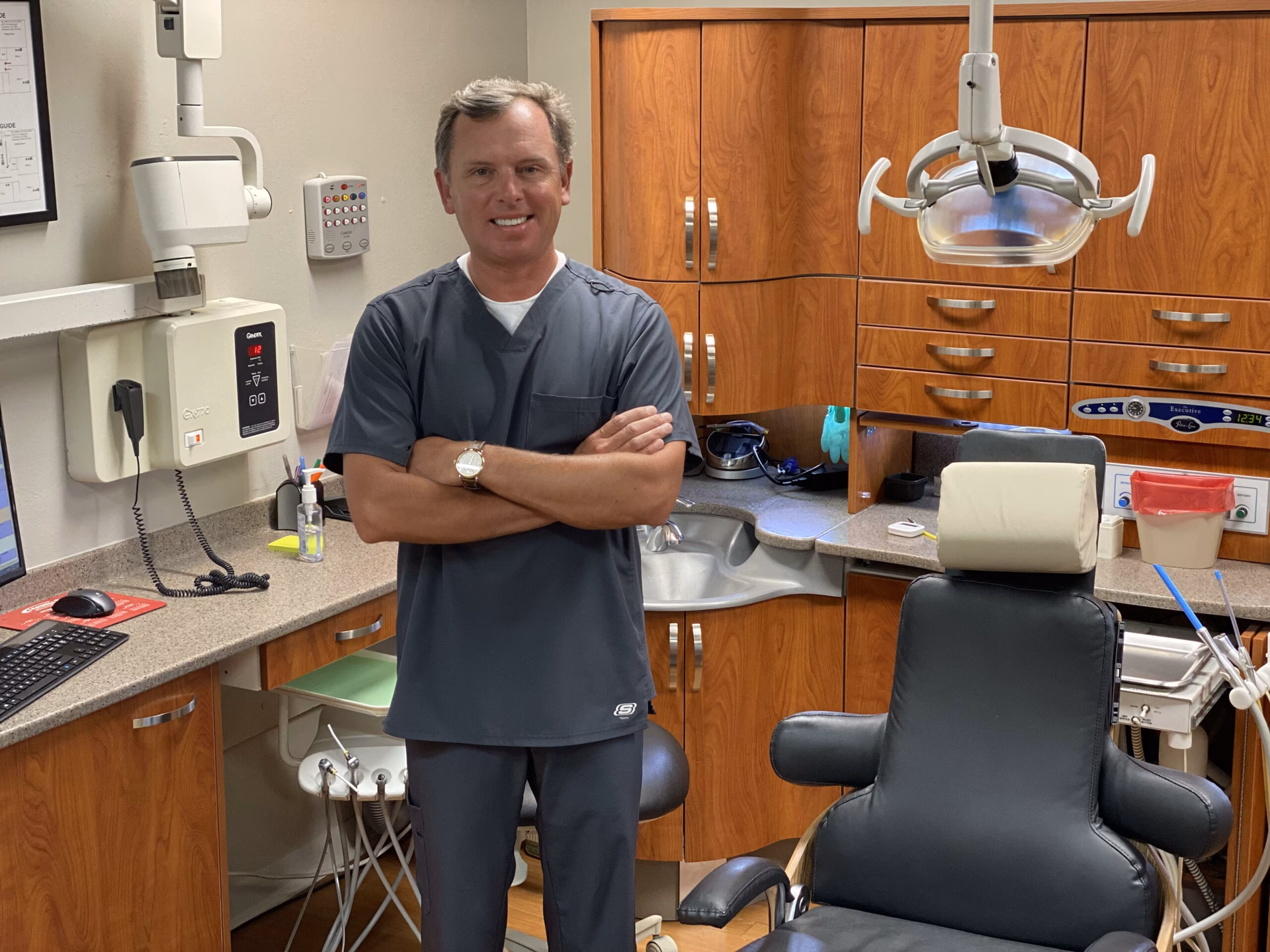 Who is Dr. Andrew Curry, DDS?