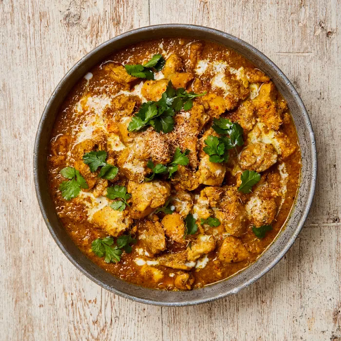 How long do you cook a chicken curry in a Dutch oven?