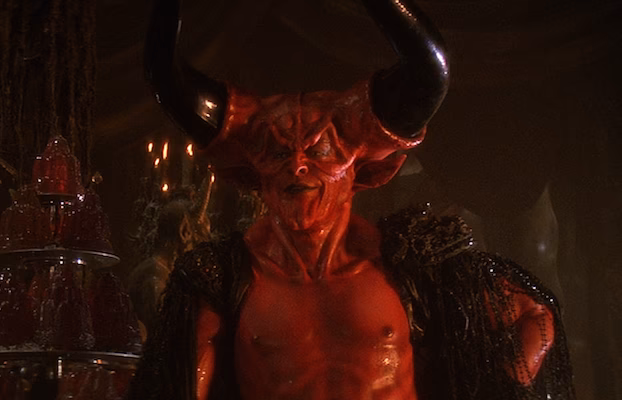 Did Tim Curry make a devil Laugh In 1985?