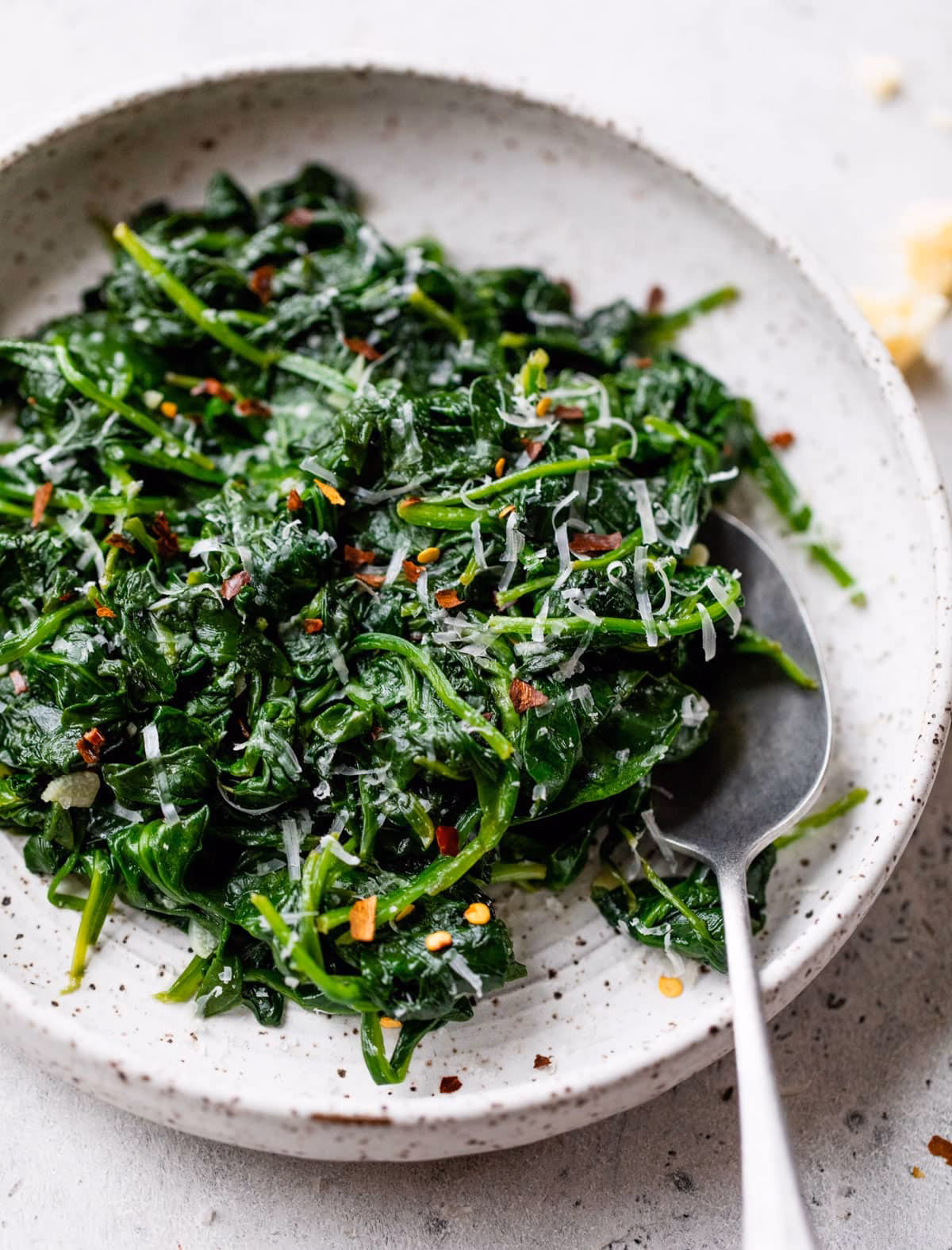 How do you spice up spinach?